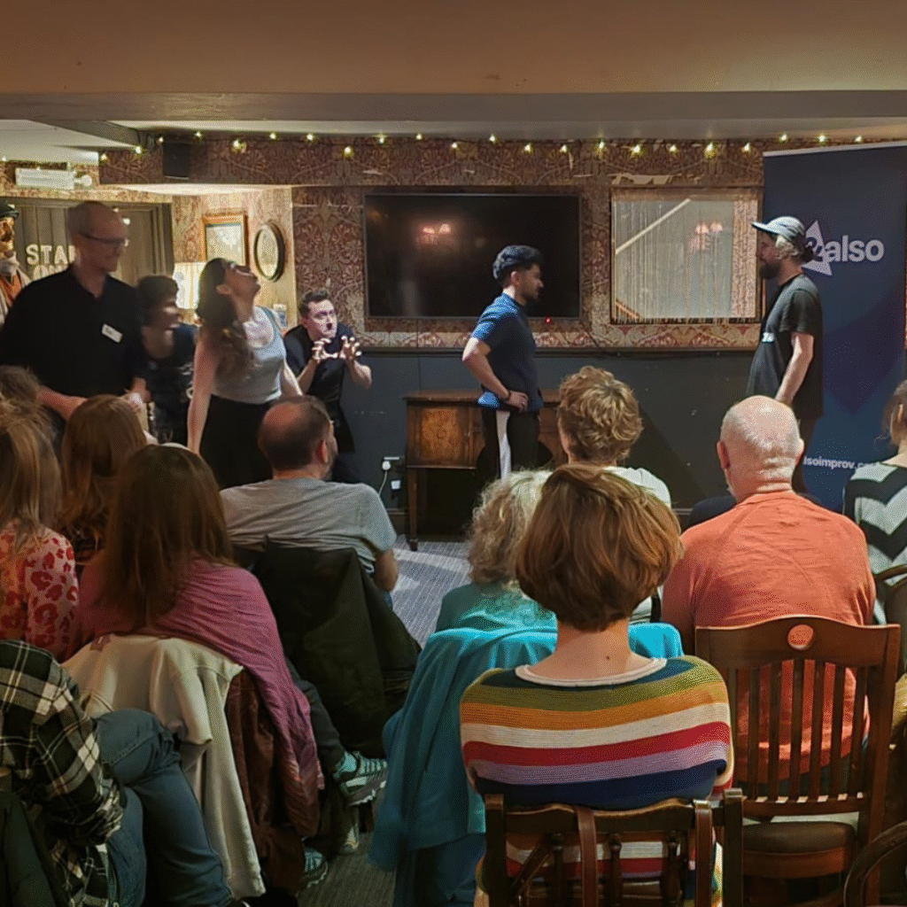 AndAlso Improv students performing live improv comedy at an improv jam in Brighton
